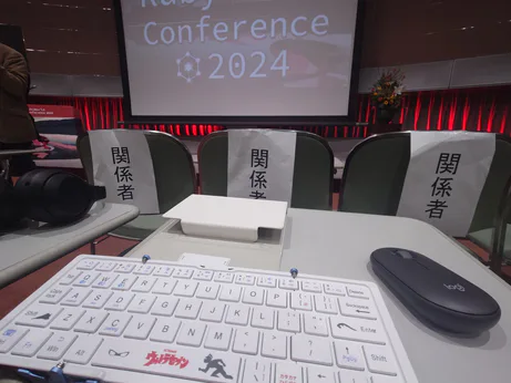 my keyboard and mouse on one of those tables integrated in the seat at ruby conference 2024